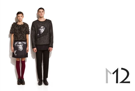 AW11 studio editorial portrait of a male and female model posing symmetrically in textured knitwear with monkey graphic details.